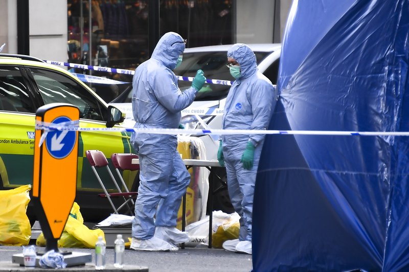 Forensic workers attend the scene on London Bridge on Saturday in London. UK counterterrorism police on Saturday searched for clues into how a man imprisoned for terrorism offenses before his release last year managed to stab several people before being tackled by bystanders and shot dead by officers on London Bridge. Two people were killed and three wounded. - AP Photo/Alberto Pezzali