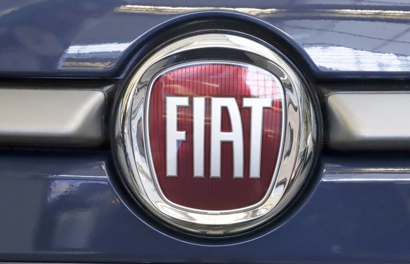 In this Feb. 14 file photo, the Fiat logo is mounted on a 2019 500 L on display at the 2019 Pittsburgh International Auto Show in Pittsburgh. Bargainers for the United Auto Workers union and Fiat Chrysler are close to reaching a tentative deal on a new four-year contract, a person briefed on the matter said Saturday. - AP Photo/Gene J. Puskar