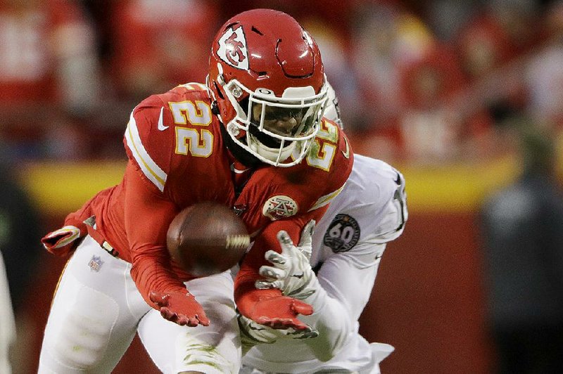 Kansas City safety Juan Thornhill intercepts a pass intended for Oakland Raiders wide receiver Keelan Doss before returning it for a touchdown during the first half Sunday in Kansas City, Mo. The Chiefs won 40-9 to take a two-game lead over the Raiders in the AFC West. story.lead_photo.caption