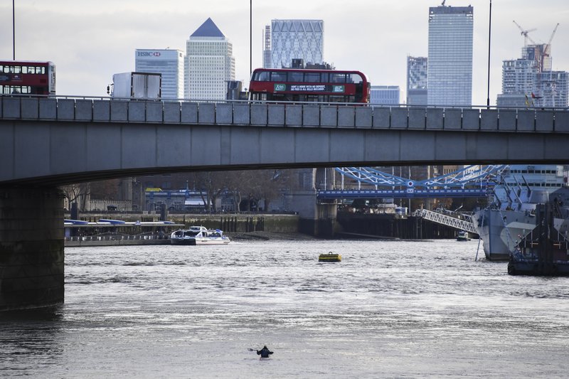 Buses and cars remain on London Bridge in London on Sunday after it being closed to traffic and public after an attack on Friday. Authorities in Britain say the convicted terrorist who stabbed to death two people and wounded three others in a knife attack Friday had been let out of prison in an automatic release program. - AP Photo/Alberto Pezzali story.lead_photo.caption