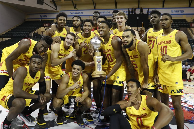Maryland poses with the Orlando Invitational trophy after defeating Marquette Sunday in Lake Buena Vista, Fla. - Photo by Scott Audette of The Associated Press story.lead_photo.caption