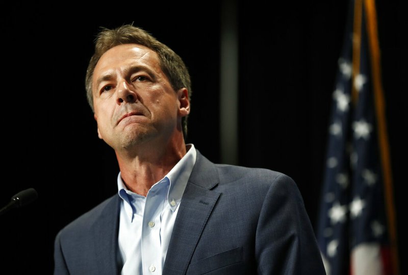 FILE - In this Sunday, June 9, 2019, file photo, Democratic presidential candidate Steve Bullock speaks during the Iowa Democratic Party's Hall of Fame Celebration, in Cedar Rapids, Iowa. Bullock announced Monday, Dec. 2, 2019, that he is ending his Democratic presidential campaign. (AP Photo/Charlie Neibergall, File)