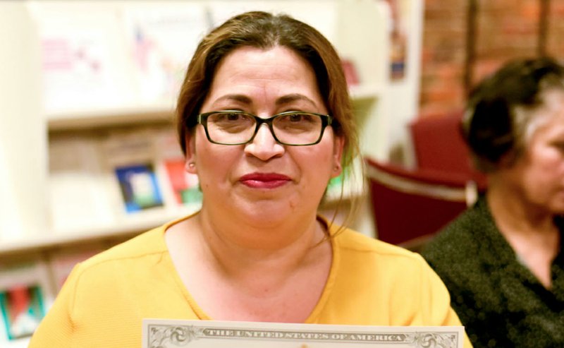 Dogwood Literacy Council student Araceli Arriaga holds her U.S. citizenship papers. The nonprofit celebrated three students on Oct. 14 who passed the exam to become U.S. citizens. Over an eight month period, eight literacy council students have become U.S. citizens with the nonprofit's support.