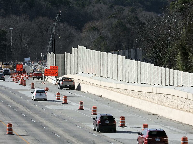 FILE - Traffic on Interstate 630 flows westward past a wall of noise barrier erected on the north side of the freeway, near the intersection of South Rodney Parham Road and South Mississippi Street in Little Rock in this Dec. 2, 2019, photo.