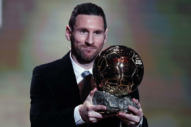 Lionel Messi of Barcelona holds the trophy of the Golden Ball after winning the Ballon d’Or for the sixth time. He previously won it in 2009, 2010, 2011, 2012 and 2015.