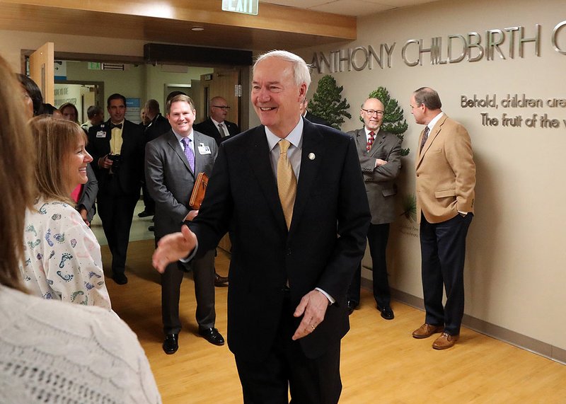 Arkansas Gov. Asa Hutchinson makes his way into the new CHI St. Vincent Hot Springs Anthony Childbirth Center on Monday. - Photo by Richard Rasmussen of The Sentinel-Record story.lead_photo.caption
