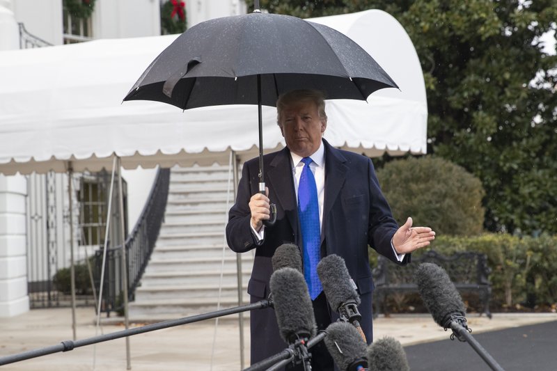 The Associated Press SOUTH LAWN: President Donald Trump speaks with reporters on the South Lawn of the White House before departing, Monday, in Washington. story.lead_photo.caption