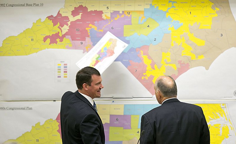 FILE - In this Feb. 16, 2016 file photo, Republican state Sens. Dan Soucek, left, and Brent Jackson, right, review historical maps during The Senate Redistricting Committee for the 2016 Extra Session in the Legislative Office Building at the N.C. General Assembly in Raleigh, N.C. North Carolina judges ordered a new U.S. House district map that Republican state legislators drew last month be used in the 2020 elections, deciding on Monday, Dec. 2, 2019, there wasn't the time to scrutinize the boundaries for extreme partisan bias. (Corey Lowenstein/The News &amp; Observer, File via AP, File)