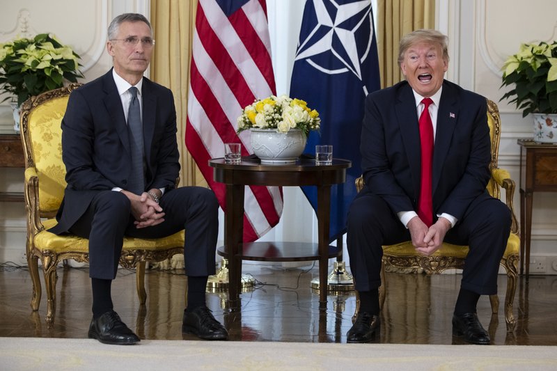 U.S. President Donald Trump speaks during a meeting with NATO Secretary General, Jens Stoltenberg at Winfield House in London, Tuesday, Dec. 3, 2019. US President Donald Trump will join other NATO heads of state at Buckingham Palace in London on Tuesday to mark the NATO Alliance's 70th birthday. (AP Photo/Evan Vucci)

