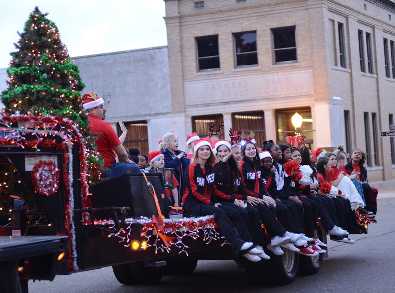 Magnolia High School cheerleaders take part in the 2018 Christmas Parade around the Magnolia Square. Between the local Chamber of Commerce, Southern Arkansas University and downtown shops, this week is set to feature three days full of holiday activities for the whole family.