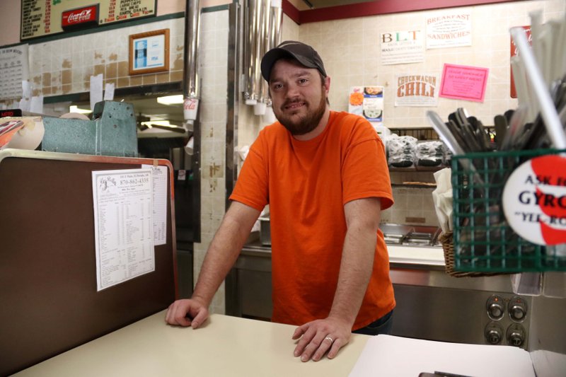 Derick Watts, new owner of La Bella, poses for a photo at the counter Nov. 19, 2019. Watts, who has worked at La Bella on-and-off for the past 16 years, said the fudge is here to stay. He said the only changes at first will be a face-lift and maybe expanding the hours and adding to the menu.