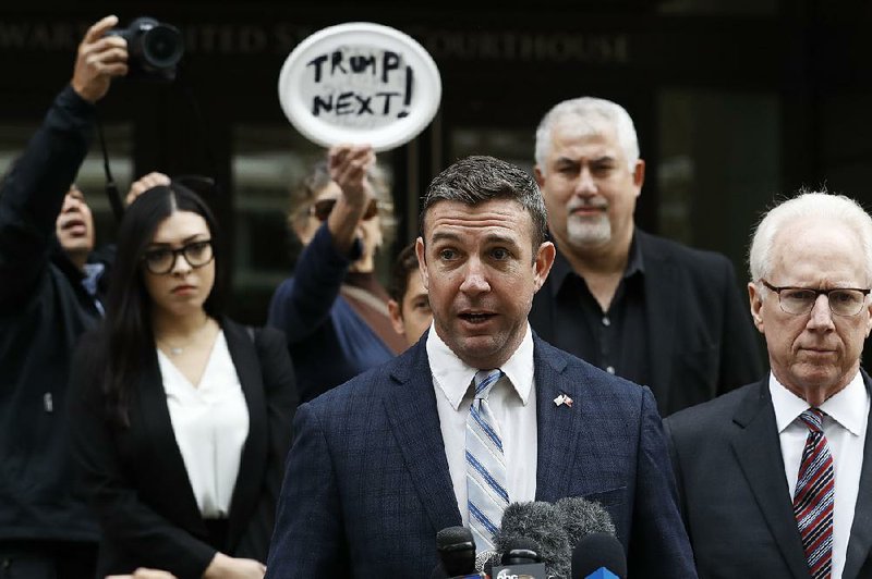 Rep. Duncan Hunter, R-Calif., speaks after leaving federal court Tuesday, Dec. 3, 2019, in San Diego. Hunter said in a TV interview that aired Monday he plans to plead guilty to the misuse of campaign funds at a federal court hearing Tuesday in San Diego. 
