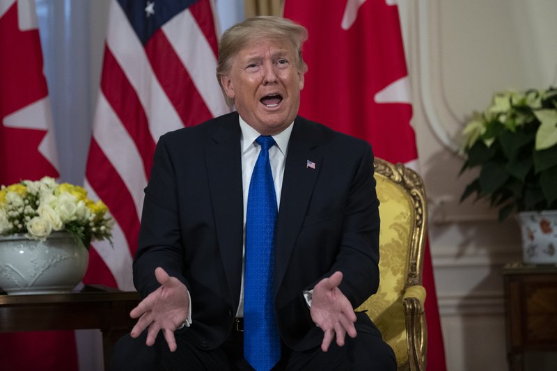 President Donald Trump speaks during a meeting with Canadian Prime Minister Justin Trudeau at Winfield House during the NATO summit, Tuesday, Dec. 3, 2019, in London. (AP Photo/ Evan Vucci)