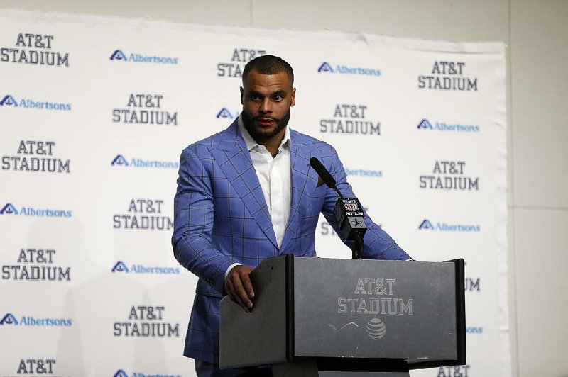 Dallas Cowboys quarterback Dak Prescott responds to questions during a post game news conference after their NFL football game agains the Buffalo Bills in Arlington, Texas, Thursday, Nov. 28, 2019. 