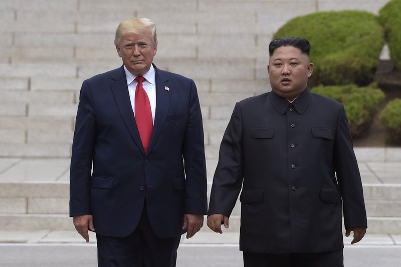 FILE - In this June 30, 2019, file photo, President Donald Trump, left, meets with North Korean leader Kim Jong Un at the North Korean side of the border at the village of Panmunjom in Demilitarized Zone. North Korea threatened Thursday, Dec. 5, to resume insults of Trump and consider him a “dotard” if he keeps using provocative language. (AP Photo/Susan Walsh, File)

