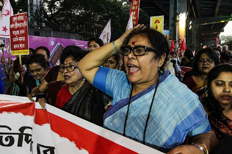 Activists march Thursday in Kolkata, India, to demand justice in the rape and murder of a 23-year-old woman. 