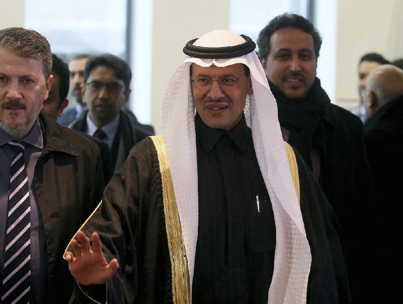 Saudi Prince Abdulaziz bin Salman (center), the country’s newly appointed oil minister, arrives Thursday for an OPEC meeting in Vienna with the chief objective of firming up oil prices ahead of an initial public offering of Saudi Aramco stock. The Saudis, along with Russia, agreed on further but small cuts in daily oil production. 