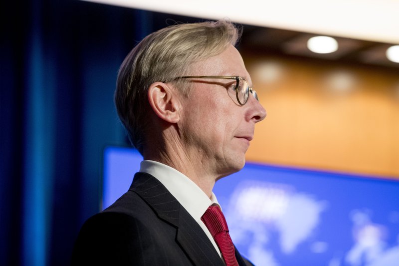 U.S. special representative for Iran Brian Hook appears on stage with Secretary of State Mike Pompeo as he speaks at a news conference at the State Department in Washington, Monday, Nov. 18, 2019.