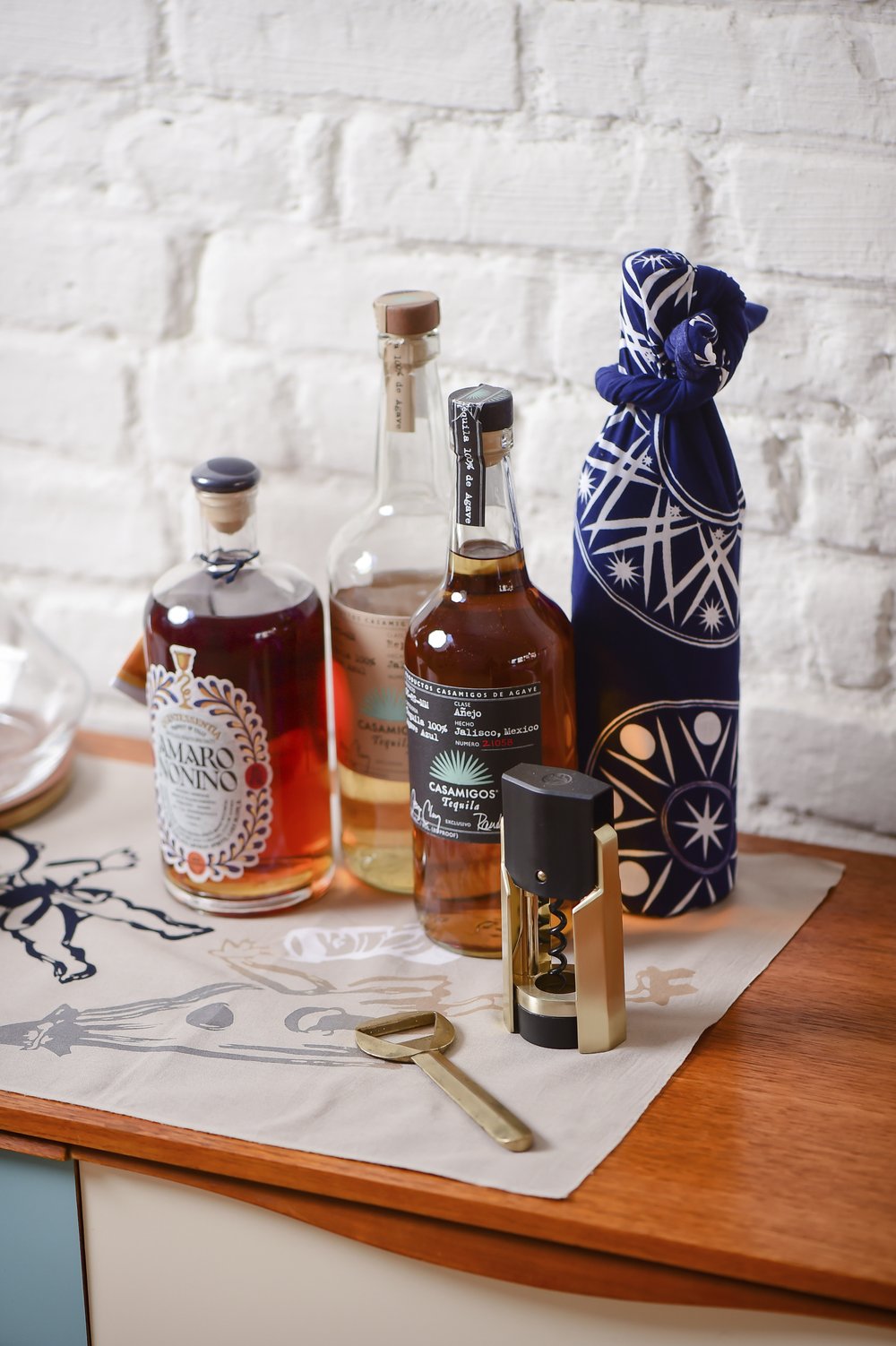 A traditional Tenugui cloth, similar to furoshiki, is used as an alternative to traditional gift wrapping for liquor bottle. Jazzy and sustainable, alternative gift wraps are gaining favor. (Max Flatow via AP/wuhao newyork Inc.)