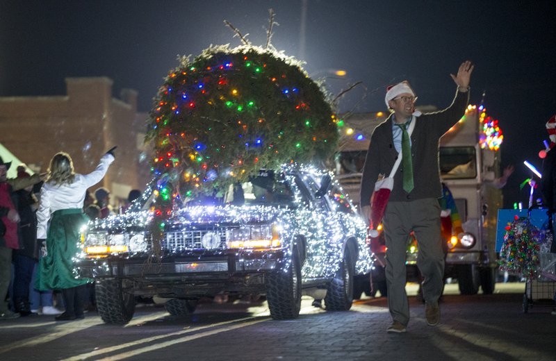 File photo-A car decorated like the Griswold family's vehicle in the movie 'National Lampoon's Christmas Vacation' passes by Friday, Dec. 6, 2019, during the Rogers Christmas Parade. 
NWA Democrat-Gazette/BEN GOFF @NWABENGOFF