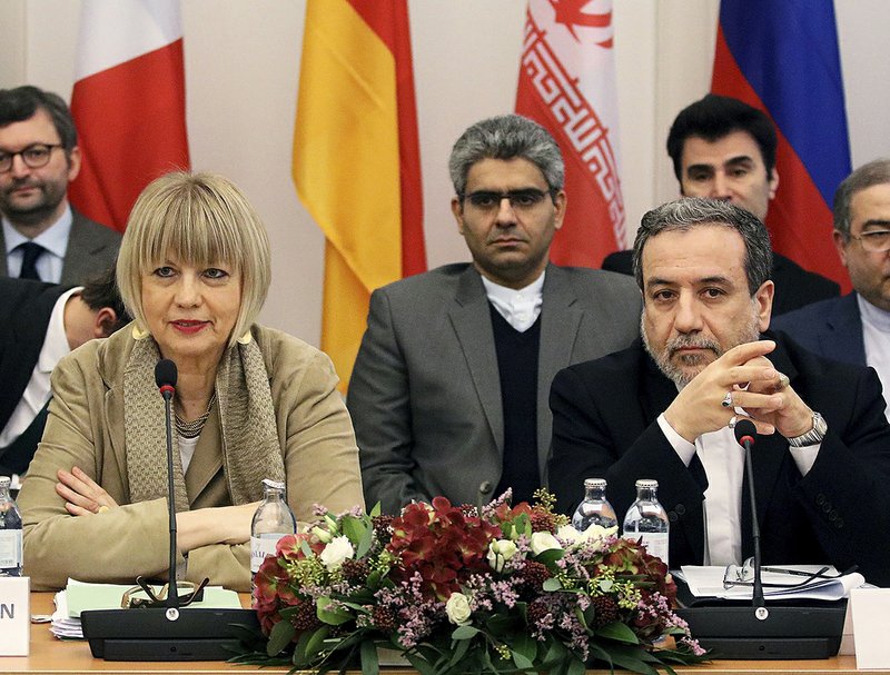 European Union foreign-policy official Helga Schmid and Iranian Deputy Foreign Minister Abbas Araghchi (right) attend a session in Vienna on Iran’s nuclear program. 