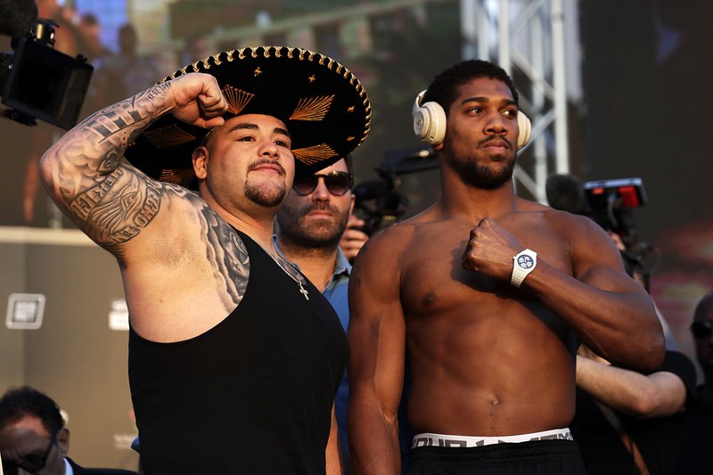 Heavyweight boxers Andy Ruiz (left) and Anthony Joshua pose during a weigh-in Friday. Their fight will take place today in Riyadh, Saudi Arabia.