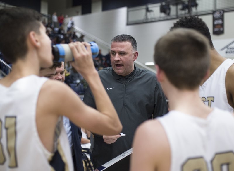 In this Jan. 2019 file photo, Bentonville West High School head coach Greg White talks to his players during a basketball game at Wolverine Arena at Bentonville West in Centerton.