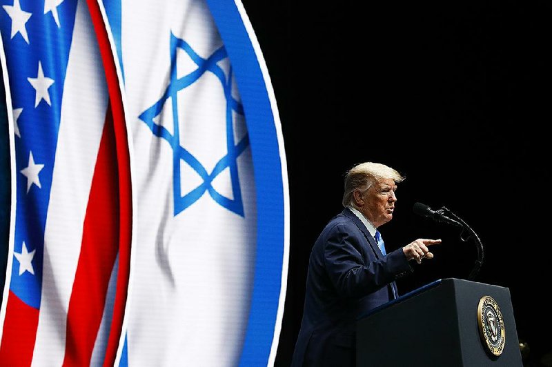 President Donald Trump speaks Saturday at the Israeli American Council National Summit in Hollywood, Fla. Before leaving the White House for Florida, Trump told reporters that Rudy Giuliani, his personal attorney, “says he has a lot of good information” from his recent trip to Ukraine that he would present to Attorney General William Barr and Congress. 