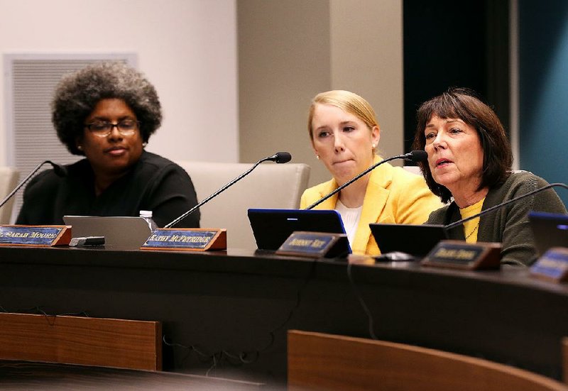 Stacey McAdoo (from left), Arkansas teacher of the year and an ex officio member of the Arkansas Board of Education, attends a board meeting in November with members Sarah Moore and Kathy McFetridge, during which the board voted 5-4 to drastically increase the size of a new personnel policy committee for the Little Rock School District. 