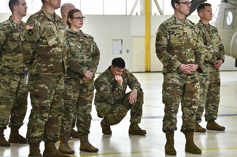 Soldiers at the Army Aviation Support Facility in St. Cloud, Minn., attend a news conference Saturday on the fatal helicopter crash. 