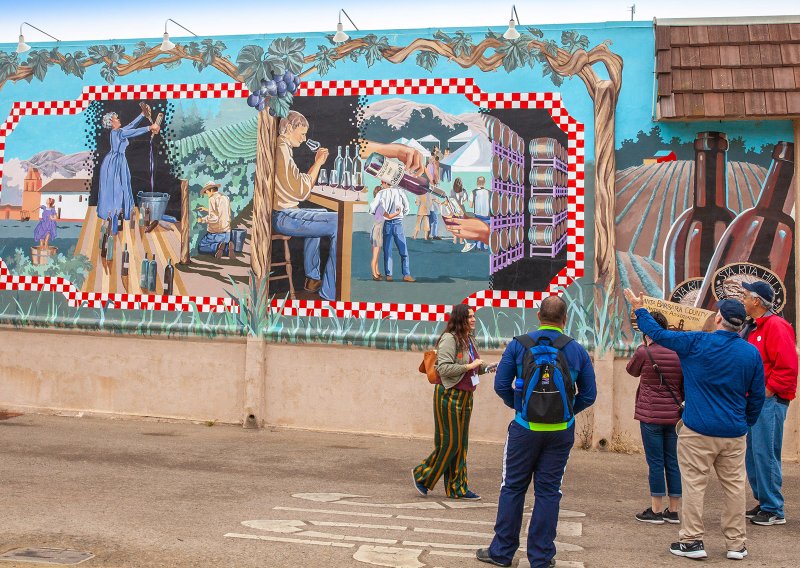 The 2008 mural "Lompoc Vintage," by painter Colleen Chronister shows scenes of wines and wine-tasting, recording Lompoc's emergence as a thriving, award-winning wine industry, its unique AVA appellation, 40 successful wine makers and popular visitor tasting rooms. (Photo by Steve Haggerty via TNS/ColorWorld)