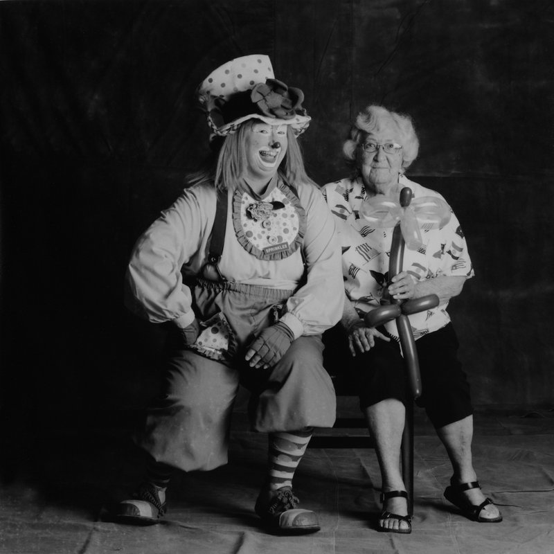 Photo by Don House; used by permission Sprinkles the Clown (Tania Tucker) and Reba Bolinger pose for Don House's camera at the Kingston Community Library in Newton County. The photograph is part of the "Remote Access Project."