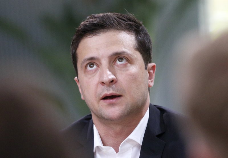 FILE - In this Oct. 10, 2019, file photo, Ukrainian President Volodymyr Zelenskiy speaks during talks with journalists in Kyiv, Ukraine. Zelenskiy travels to Paris on Monday, Dec. 9, for a summit meeting with the leaders of Russia, France and Germany. (AP Photo/Efrem Lukatsky, File)