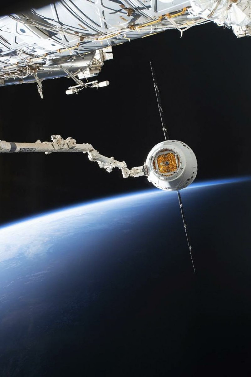 The SpaceX Dragon is shown arriving at the International Space Station on Sunday. It was the third visit to the station for the Dragon capsule, which arrived with 3 tons of supplies, including 40 mice for a muscle and bone experiment. 