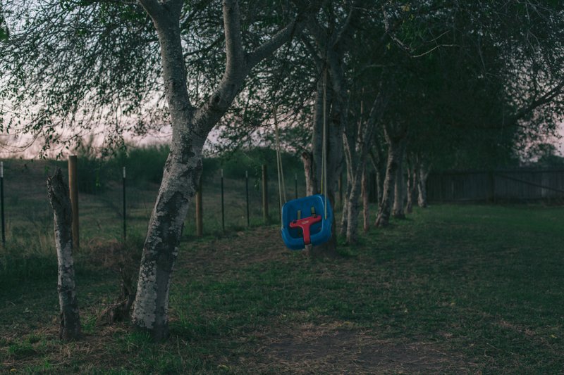 A swing sits in the backyard of Salvador Castillo and Yvette Arroyo's home next to the Rio Grande levee in Brownsville, Texas. MUST CREDIT: Photo by Brenda Baz&#x1ba0;for The Washington Post