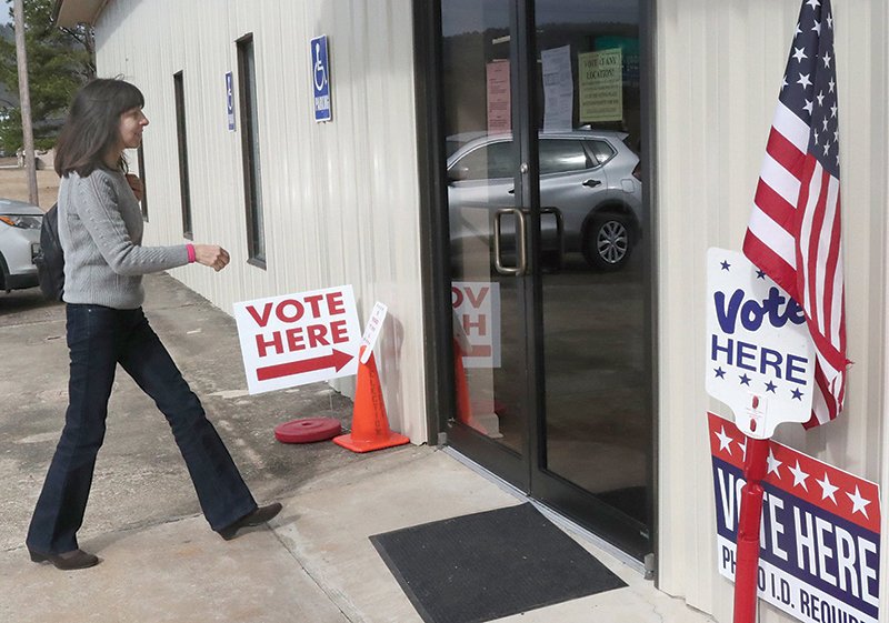 SPECIAL PRIMARY ELECTION Gabriela Hogue enters Community Baptist Church on Highway 7 north Monday to cast an early ballot in the Republican primary for the March 3 House District 22 special election. The church is one of five vote centers that will be open for today’s primary between Richard McGrew and Jack Wells. - Photo by Richard Rasmussen of The Sentinel-Record