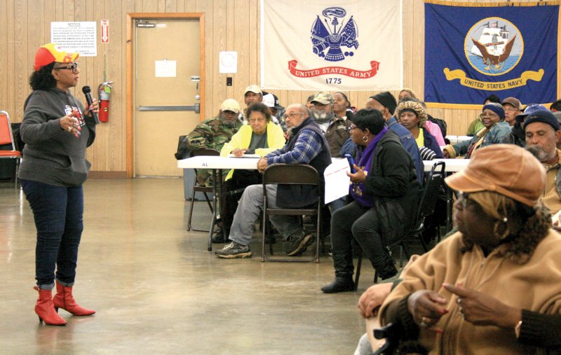 Mae Olison speaks to attendees at the annual Buggs-Olison meat giveaway in El Dorado on Saturday at the American Legion post.