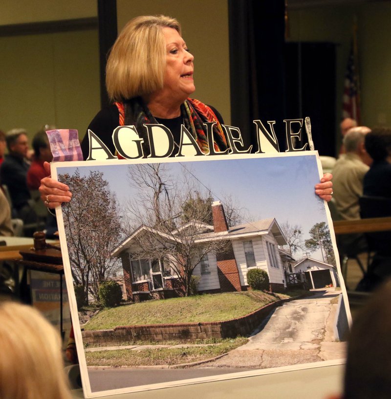 Becky Choate, president of the board of directors for Magdalene House, presents an image of the house during the Rotary Club meeting Dec. 9, 2019. Choate said the house will be completed and accept applications after the new year.