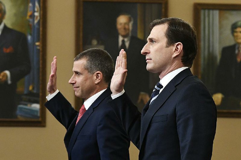 Steve Castor (left), the House Judiciary Committee’s minority counsel, and Dan Goldman, the director of investigations for the House Intelligence Committee, are sworn in during Monday’s judiciary panel hearing. More photos are available at arkansasonline.com/1210impeachment/. 