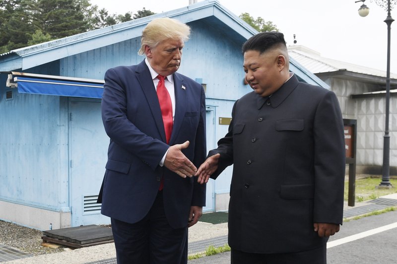 FILE - In this June 30, 2019, file photo, U.S. President Donald Trump meets with North Korean leader Kim Jong Un at the border village of Panmunjom in the Demilitarized Zone, South Korea. North Korea has again insulted President Donald Trump, calling him a &#x201c;thoughtless and sneaky old man&#x201d; after he tweeted that North Korean leader Kim Jong Un wouldn&#x2019;t want to abandon a special relationship between the two leaders and affect the American presidential election by resuming hostile acts. (AP Photo/Susan Walsh, File)