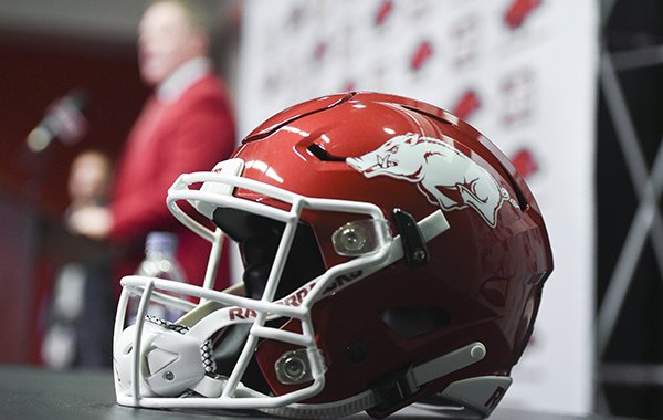An Arkansas football helmet is shown as athletics director Hunter Yurachek during the introduction of new football coach Sam Pittman on Monday, Dec. 9, 2019, in Fayetteville.