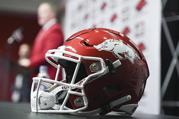 An Arkansas football helmet is shown as athletics director Hunter Yurachek during the introduction of new football coach Sam Pittman on Monday, Dec. 9, 2019, in Fayetteville. 