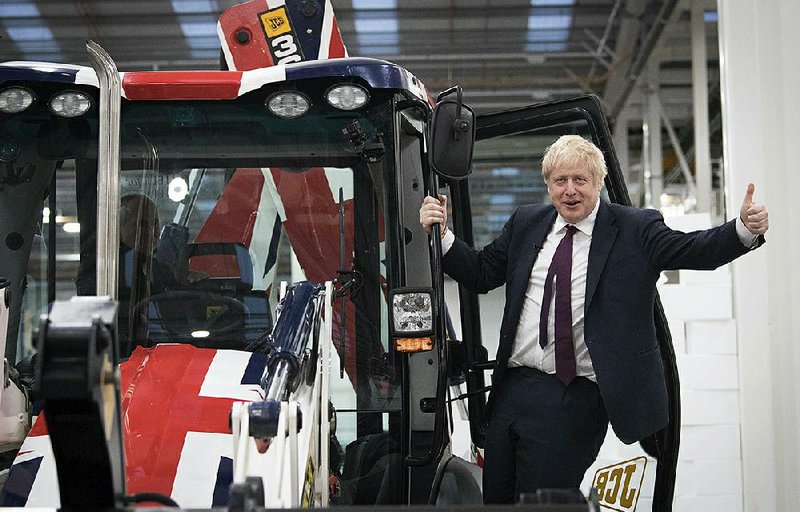 British Prime Minister Boris Johnson campaigns Tuesday at a construction equipment manufacturing center in Uttoxeter in central England as criticism swirled over charges that he exploited the recent London Bridge attack for political gain. More photos available at arkansasonline.com/1211uk/.
(AP/Stefan Rousseau)