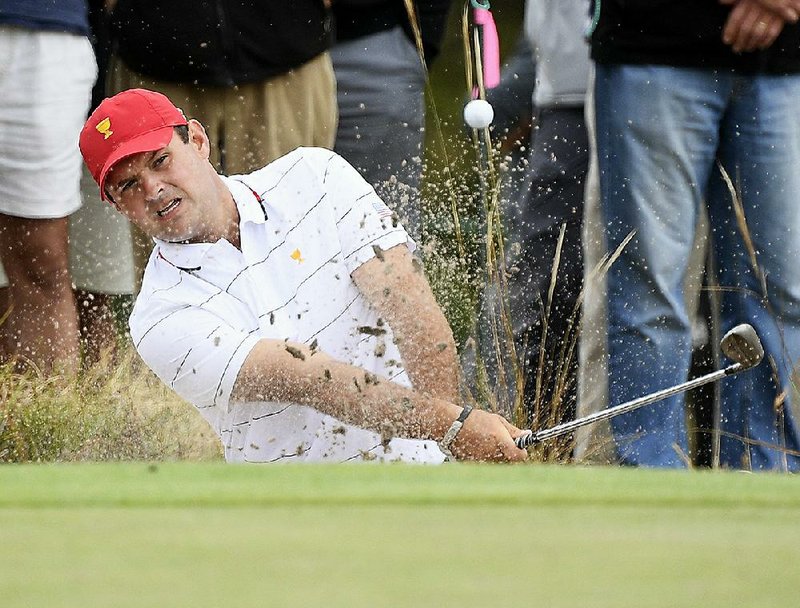 Patrick Reed of the United States team in the Presidents Cup remains under scrutiny after being penalized two shots for moving sand away from his ball in a waste bunker at last week’s Hero World Challenge.
(AP/Andy Brownbill)