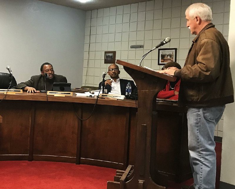 Jimmy Dill (right), a Pine Bluff attorney who is chairman of the board that oversees activities of the Pine Bluff Urban Renewal Agency, listens as Alderman Bruce Lockett (left) asks a question. Also pictured is Alderman Donald Hatchett.
(Arkansas Democrat-Gazette/Dale Ellis)