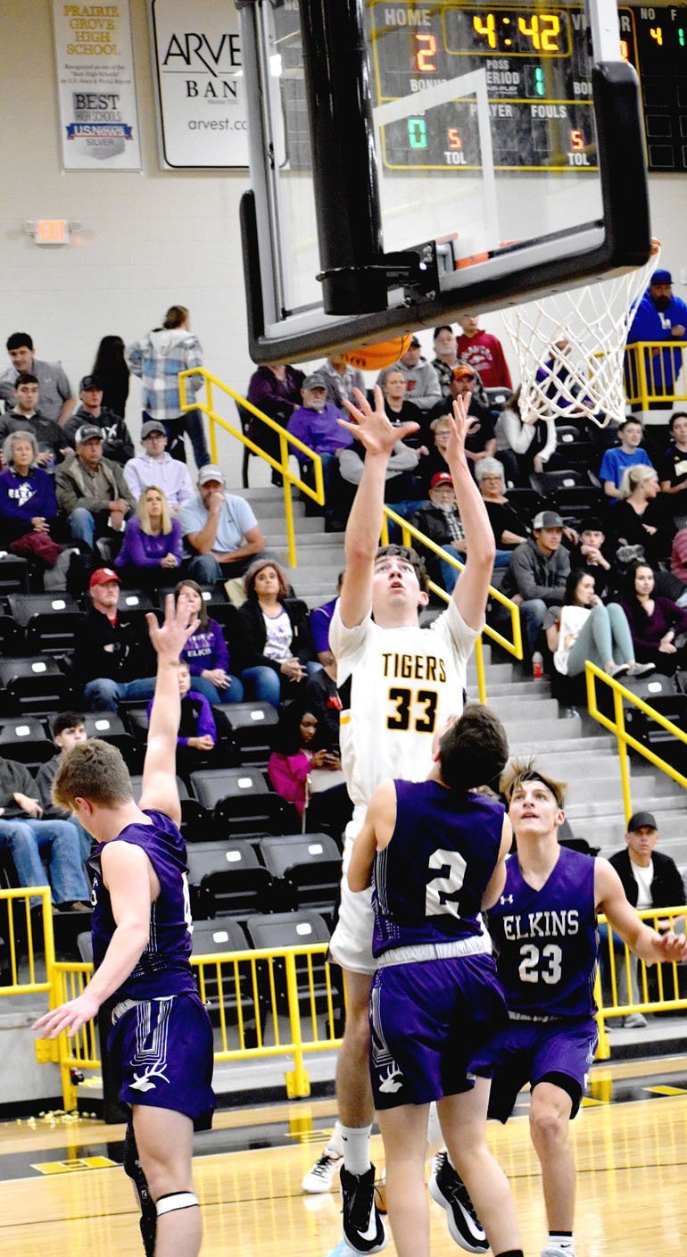 MARK HUMPHREY ENTERPRISE-LEADER/Prairie Grove senior Alex Edmiston goes up for a basket against Elkins. The Tigers lost 52-41 Friday. Edmiston led Prairie Grove with 13 points.