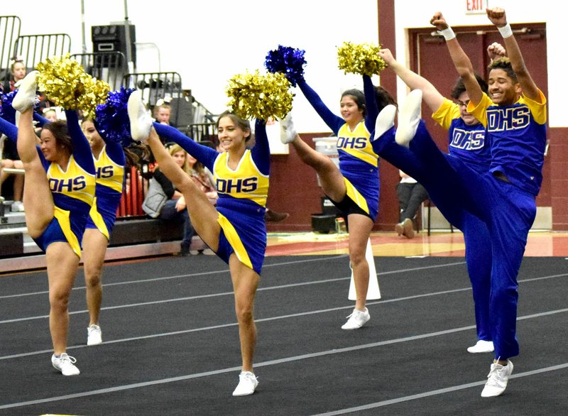 Westside Eagle Observer/MIKE ECKELS The Decatur Cheer team does a high kick near the end of its performance during the Gentry Cheer Competition at Pioneer Gym Thursday afternoon.