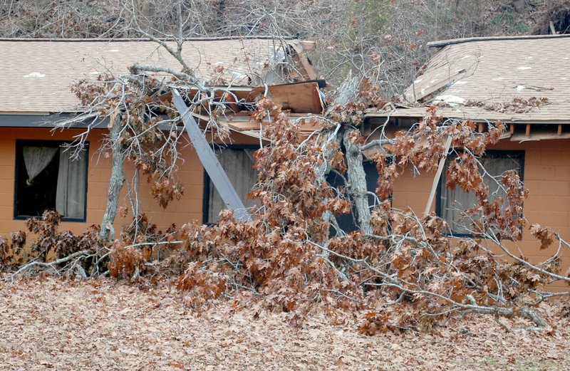 Marc Hayot/Herald Leader A tree fell through the roof of one of the bunk houses at the southern end of Camp Siloam during the Oct. 21 storms. The camp was hit hard by storms in June and October.