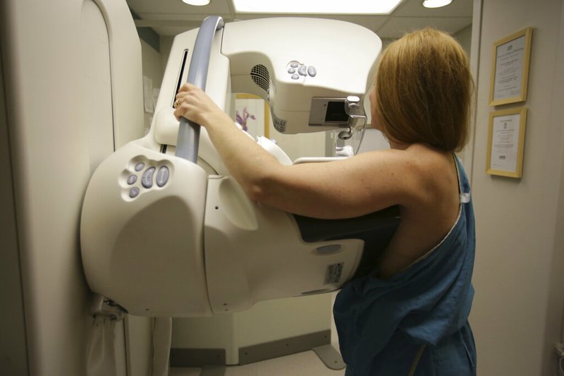 In this May 22, 2015 photo, a woman gets a mammogram at the University of Michigan Cancer Center in Ann Arbor, Mich. Doctors are reporting unusually good results from tests of two experimental drugs in women with an aggressive form of breast cancer that had spread widely and resisted many previous treatments. Results were disclosed Wednesday, Dec. 11, 2019, at the San Antonio Breast Cancer Symposium and in the New England Journal of Medicine. (Kimberly P. Mitchell/Detroit Free Press via AP, File)