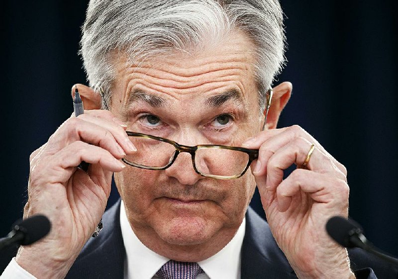 After the Federal Reserve Board voted unanimously Wednesday to leave interest rates unchanged, Fed Chairman Jerome Powell said the Fed’s actions have “kept the economy on track.” More photos are available at arkansasonline.com/1212powell/.
(AP/Jacquelyn Martin)